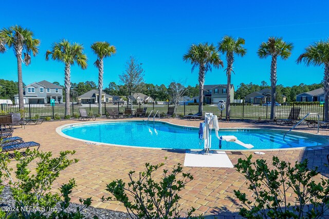 view of swimming pool featuring a patio