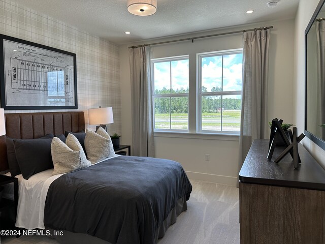 86 Delwood Way Unit 269, Saint Augustine, FL 32092 - carpeted bedroom featuring multiple windows and a textured ceiling