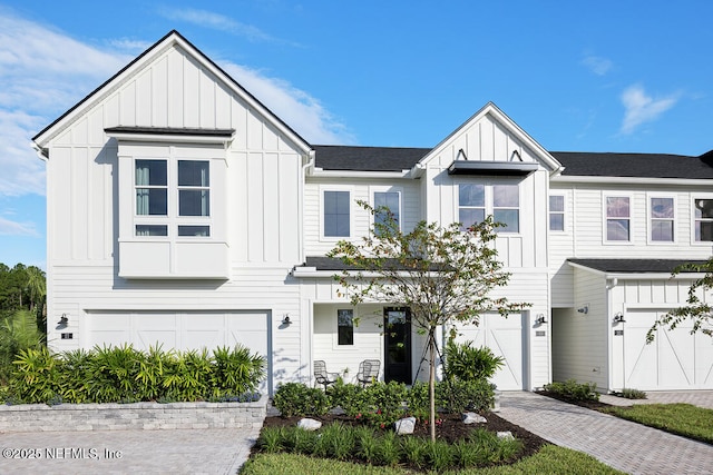 modern farmhouse style home featuring a garage