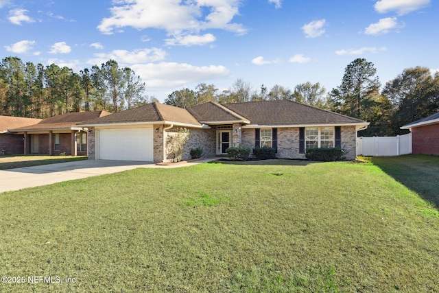 single story home featuring a garage and a front yard