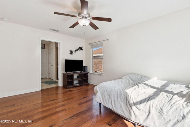 bedroom featuring ceiling fan and dark hardwood / wood-style flooring