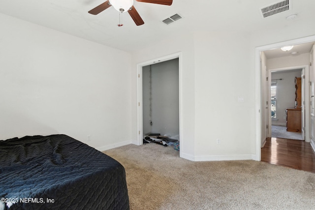 bedroom featuring ceiling fan and light colored carpet