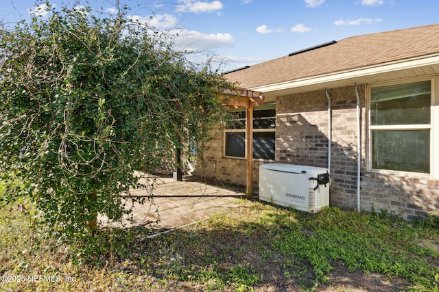 view of side of home featuring a pergola