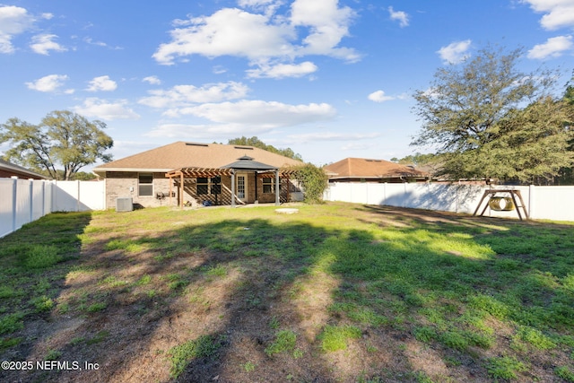 view of yard featuring a pergola and central AC unit