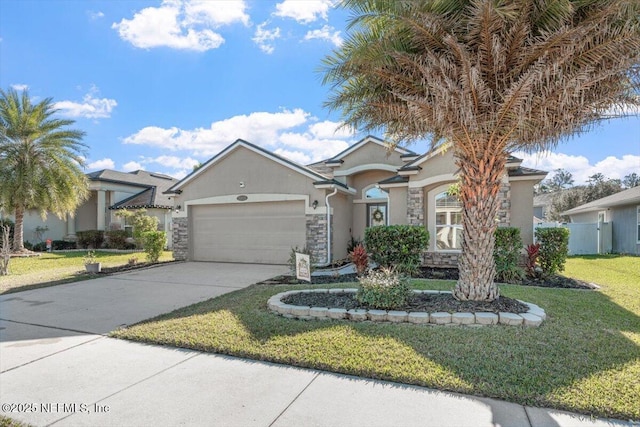 view of front of home with a garage and a front lawn