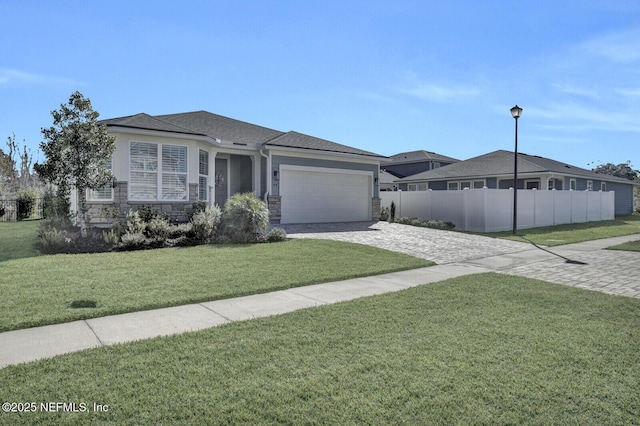 view of front of house with a garage and a front yard