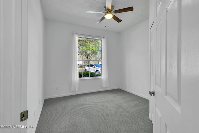 carpeted empty room featuring a textured ceiling and ceiling fan