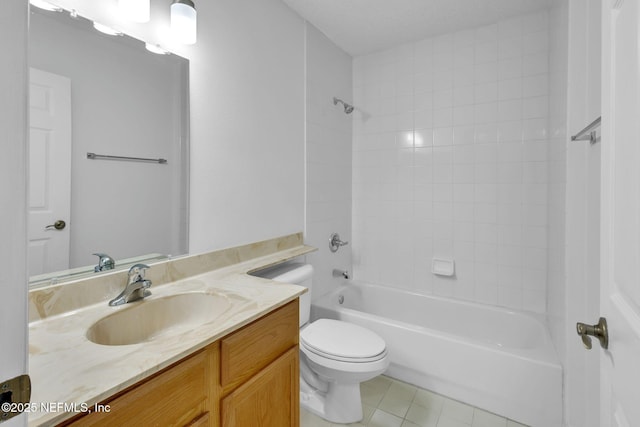 full bathroom with tiled shower / bath, tile patterned flooring, vanity, and toilet