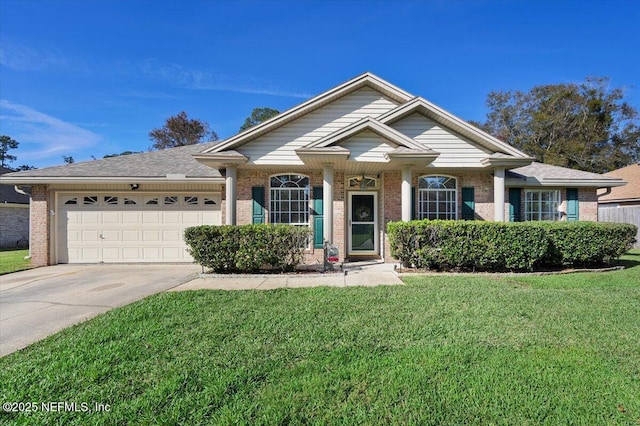 view of front of house with a front yard and a garage