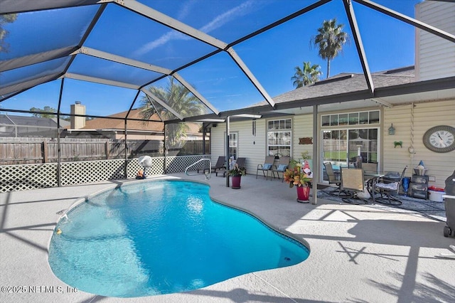 view of pool with a lanai and a patio