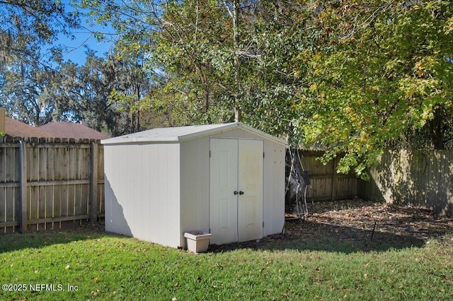 view of outdoor structure featuring a yard