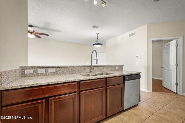 kitchen featuring sink, ceiling fan, light tile patterned floors, stainless steel dishwasher, and pendant lighting