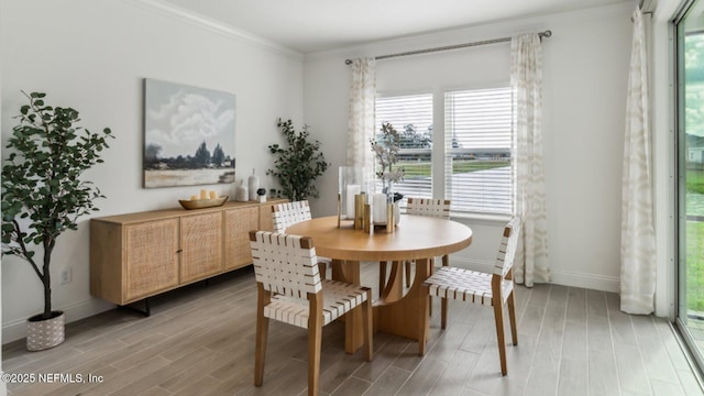 dining area featuring crown molding