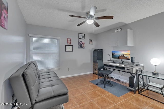 tiled office space with ceiling fan and a textured ceiling