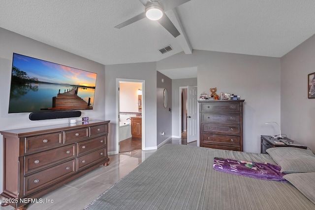 bedroom featuring connected bathroom, ceiling fan, a textured ceiling, and vaulted ceiling with beams