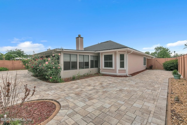 back of house featuring a patio