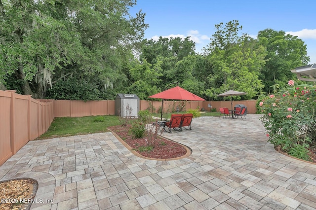 view of patio / terrace with a storage unit