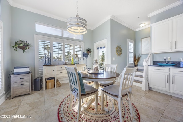 tiled dining room with a chandelier and crown molding