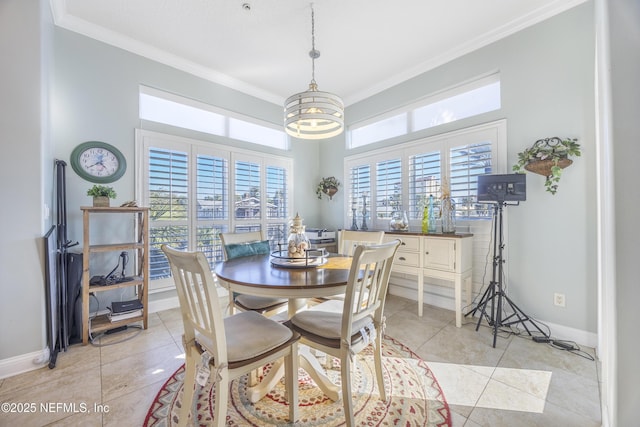 dining space with light tile patterned flooring, ornamental molding, and an inviting chandelier