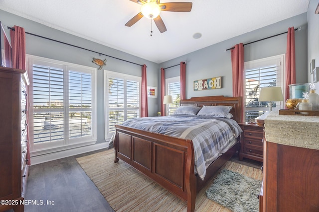 bedroom featuring light hardwood / wood-style floors and ceiling fan