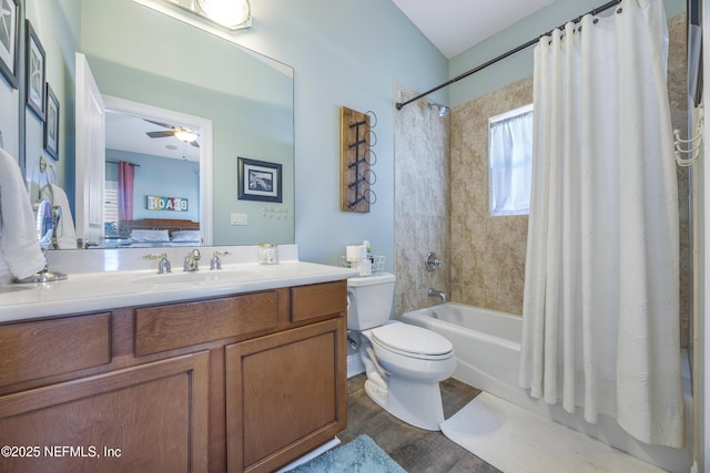 full bathroom with vanity, ceiling fan, toilet, shower / bath combo with shower curtain, and wood-type flooring