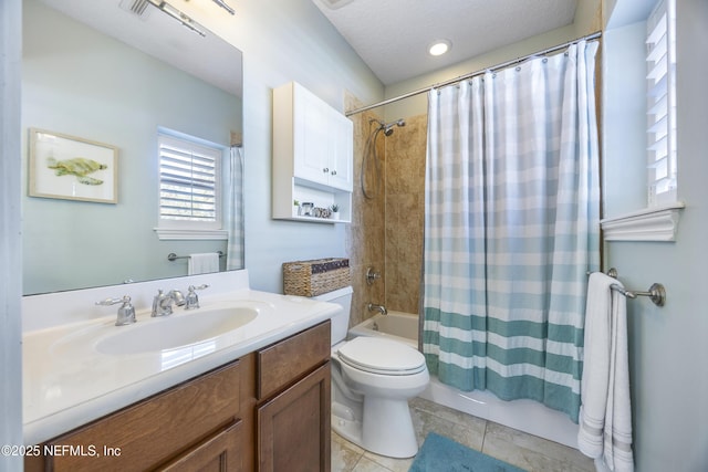 full bathroom featuring tile patterned floors, a textured ceiling, vanity, shower / bath combo with shower curtain, and toilet