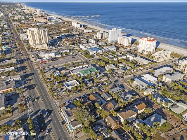 aerial view with a water view and a view of the beach