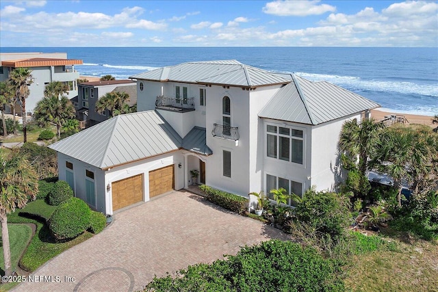 aerial view with a water view and a view of the beach