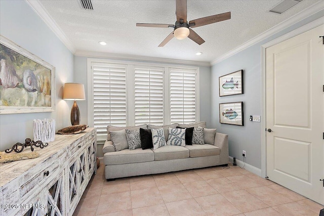 tiled living room with ceiling fan, ornamental molding, and a textured ceiling