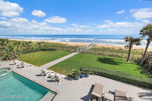 aerial view featuring a view of the beach and a water view