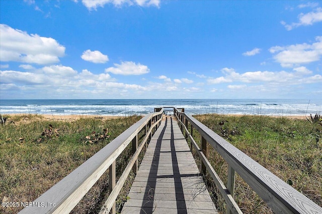 view of community featuring a water view and a view of the beach