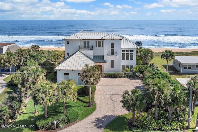 birds eye view of property featuring a view of the beach and a water view