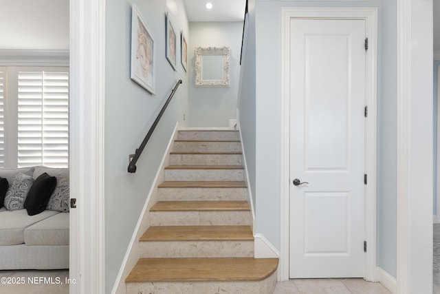 stairway with tile patterned flooring