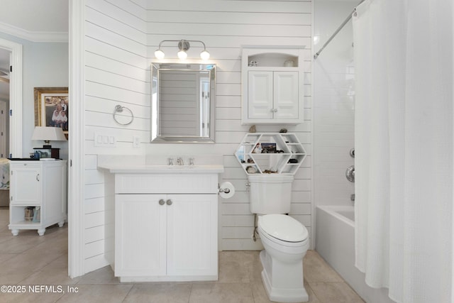 full bathroom featuring vanity, tile patterned floors, toilet, shower / bathtub combination with curtain, and ornamental molding