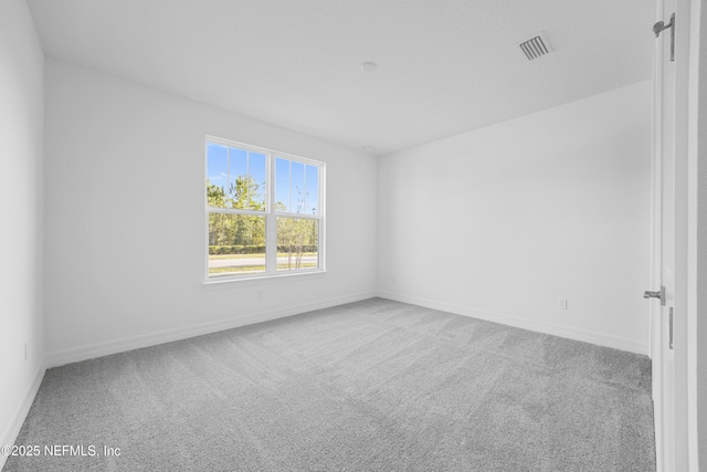 spare room with carpet floors