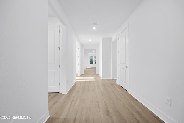 hallway featuring light wood-type flooring