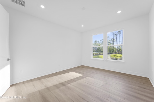 unfurnished room featuring light wood-type flooring