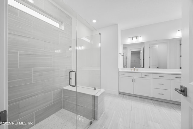 bathroom with vanity and walk in shower