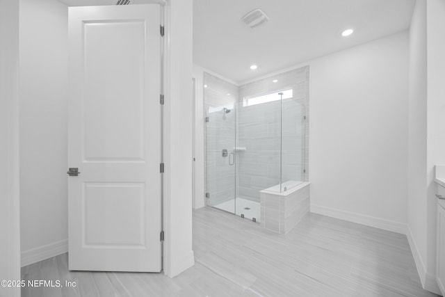 bathroom with vanity and an enclosed shower