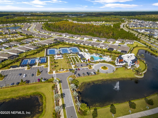 birds eye view of property featuring a water view