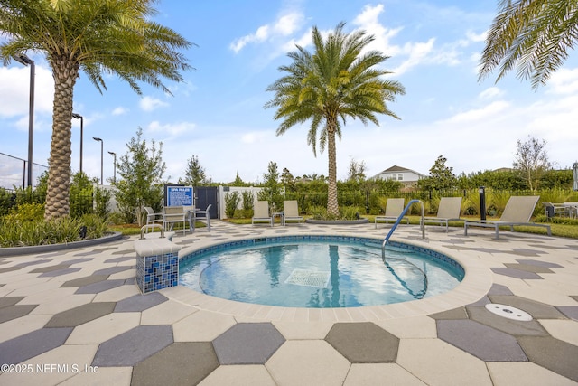 view of swimming pool featuring a patio