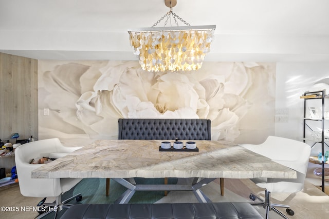 dining space with wooden walls and a chandelier