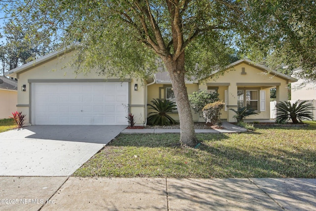 view of front of property with a garage and a front lawn