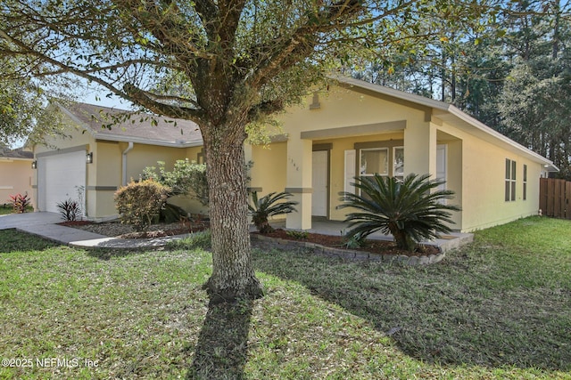 single story home featuring a front yard and a garage