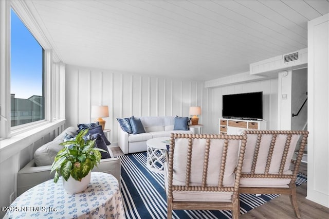 living room featuring wooden ceiling and hardwood / wood-style flooring