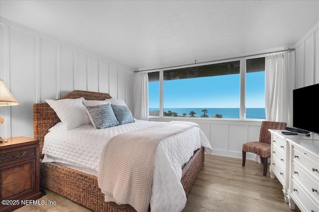 bedroom with light hardwood / wood-style floors