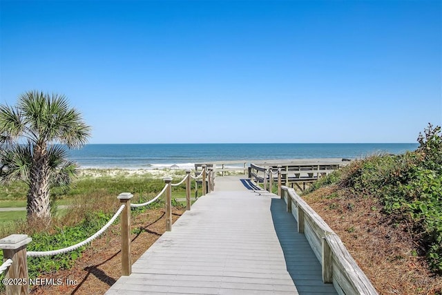 exterior space with a water view and a view of the beach