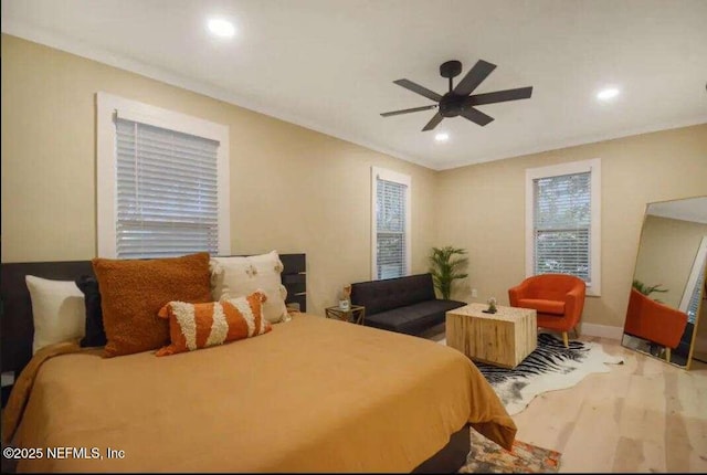 bedroom featuring light wood-type flooring and ceiling fan