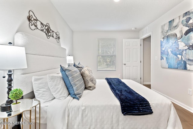 bedroom featuring hardwood / wood-style flooring