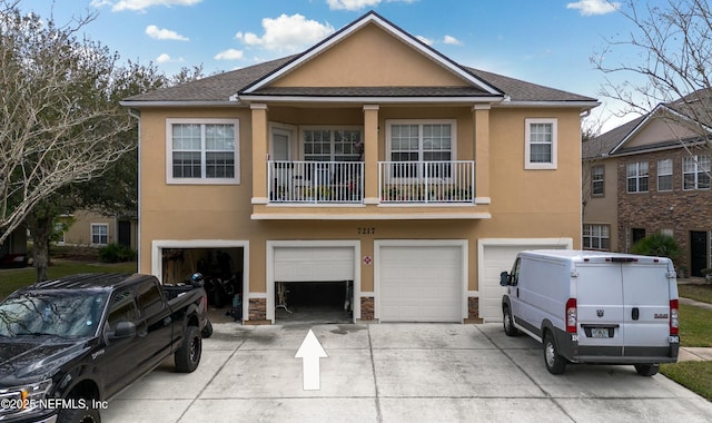 view of front of property featuring a balcony